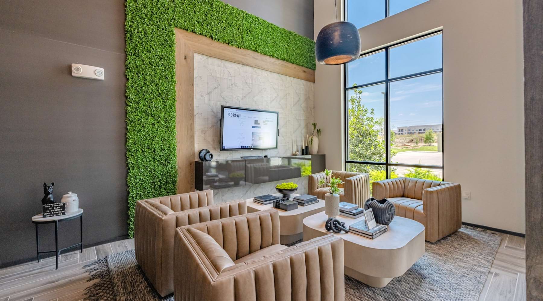 Shared lounge space with plush seating at Brea Frisco luxury apartments in Frisco, TX Shared lounge space with plush seating at Brea Frisco luxury apartments in Frisco, TX