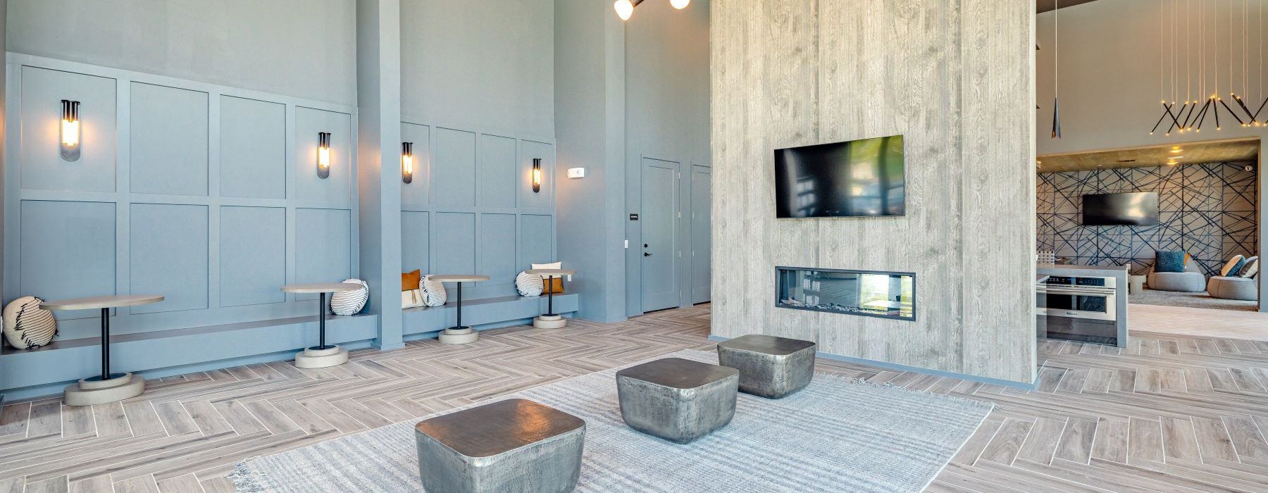 a clubroom with a tv and a fireplace