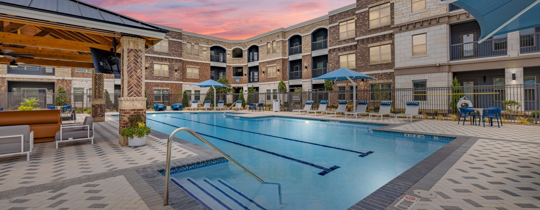 Resort-style pool, sun deck, and luxury apartment amenities at Brea Frisco in Frisco, Texas