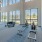Large fitness center with large windows and plenty of equipment