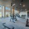 Large fitness center with large windows and plenty of equipment