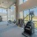 Large fitness center with large windows and plenty of equipment