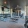 Large fitness center with large windows and plenty of equipment