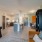 Spacious and well lit kitchen with wood flooring and stainless steel appliances